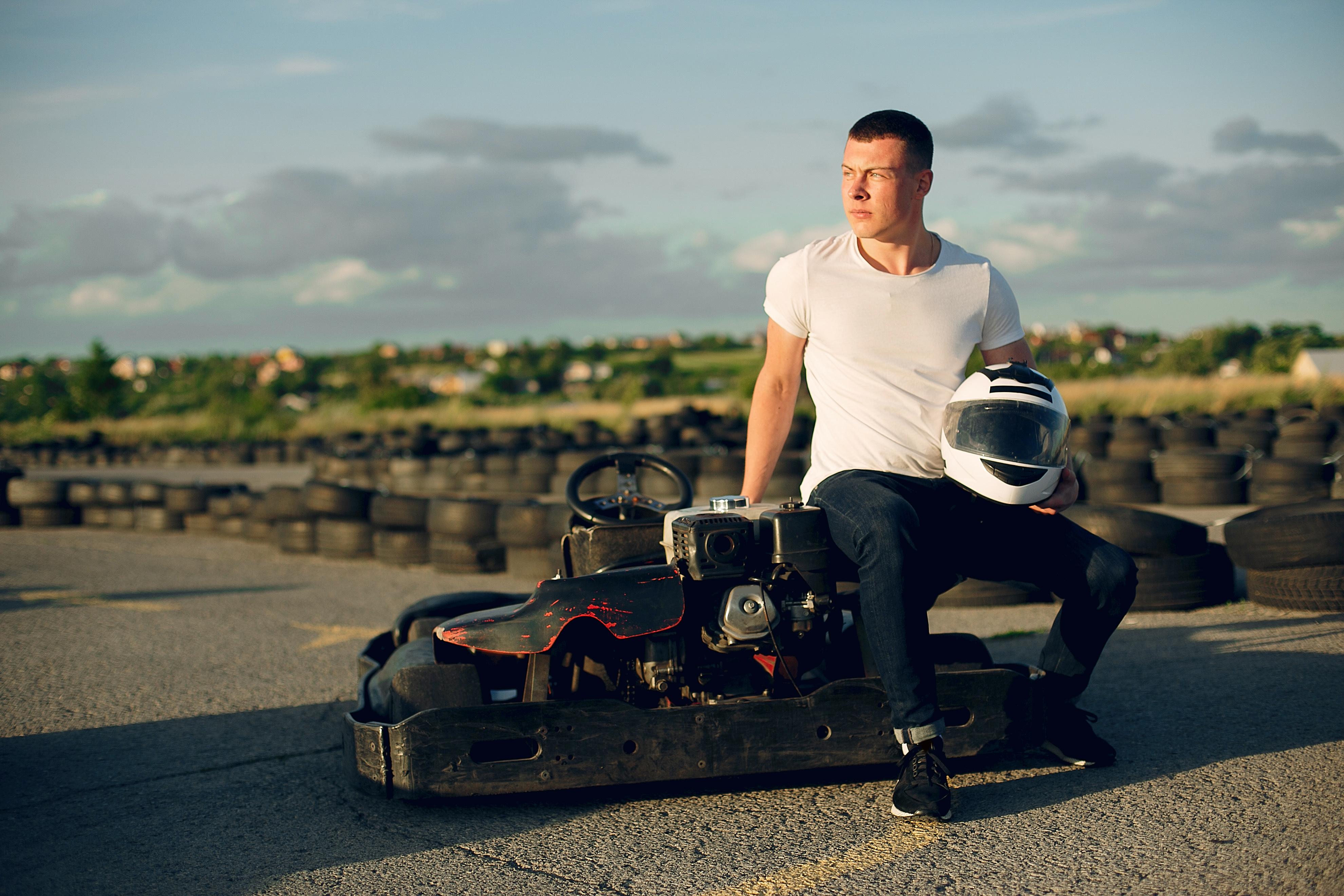 handsome man in a karting with a car